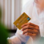 person holding credit card